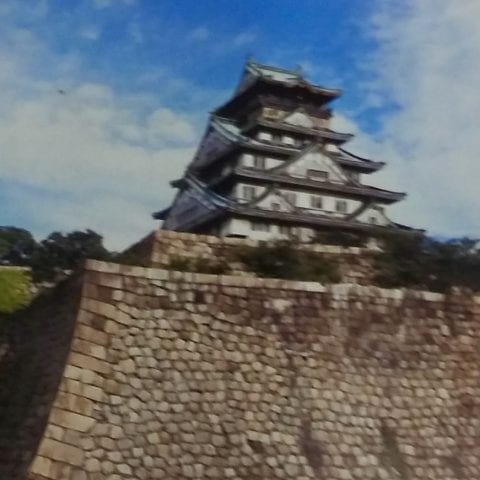 A Japanese castle against a blue sky